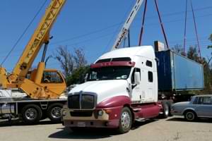 Loading Shipping Container Onto Truck to Send to Afghanistan